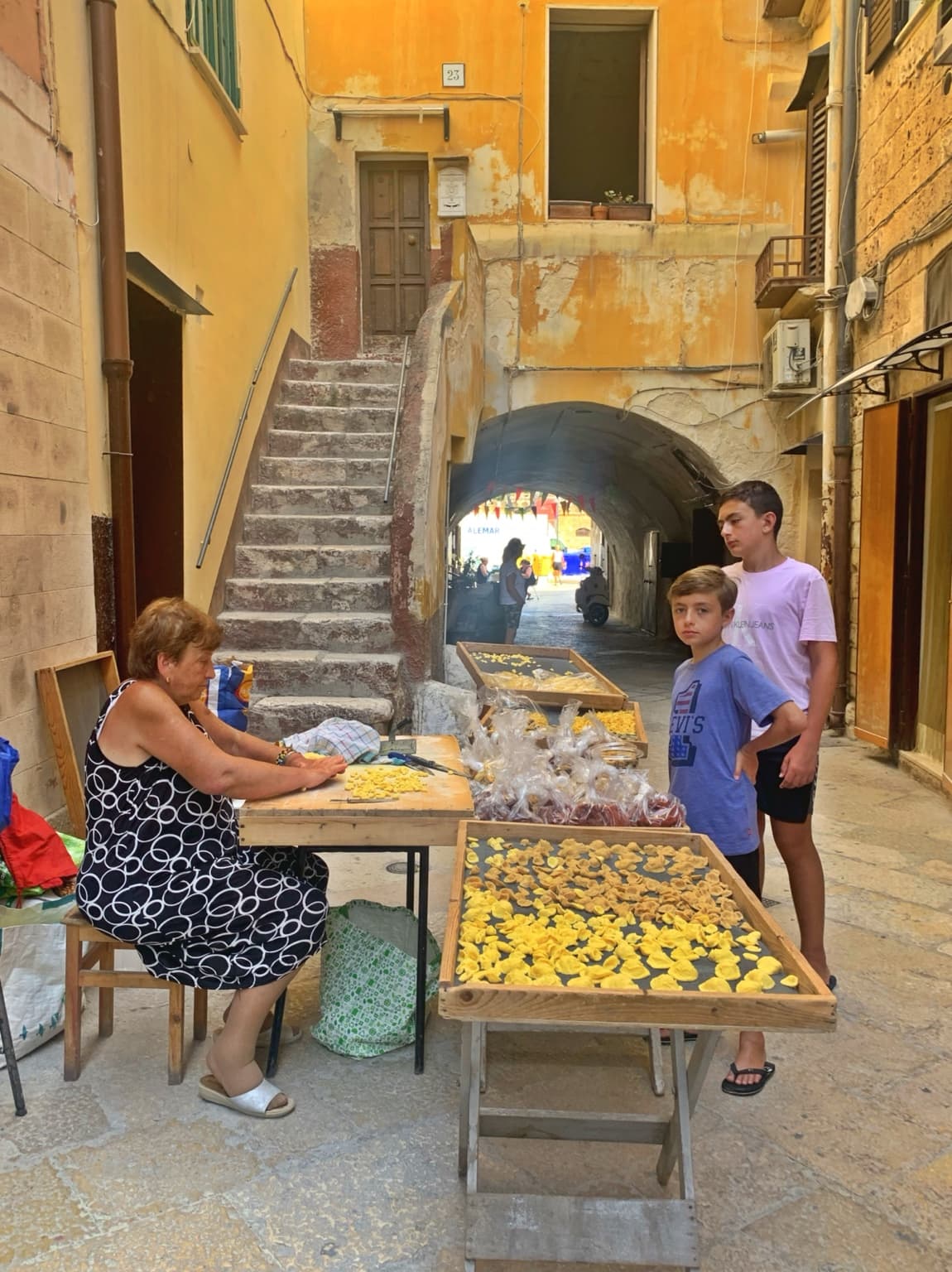 Handmade orecchiette on a historic street in Bari Vecchia