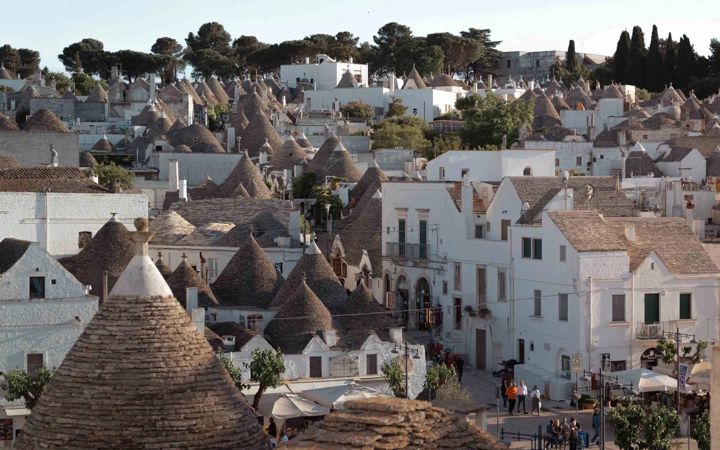 trulli rooftops in Alberobello with white walls and conical stone roofs